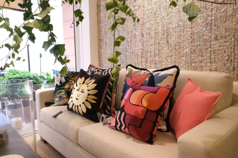 Cushions and fabrics on a sofa by the window